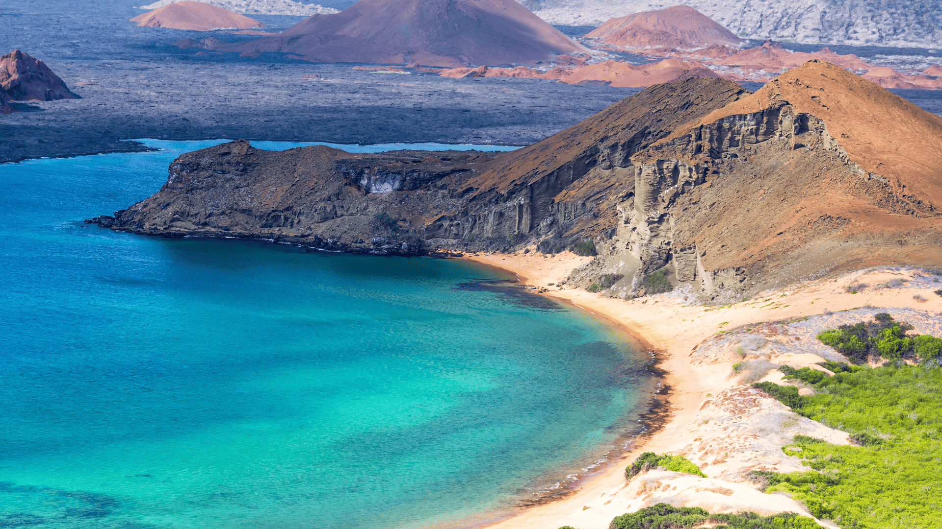 Bartolomé Island, Galápagos — volcanic cones and turquoise bay from above